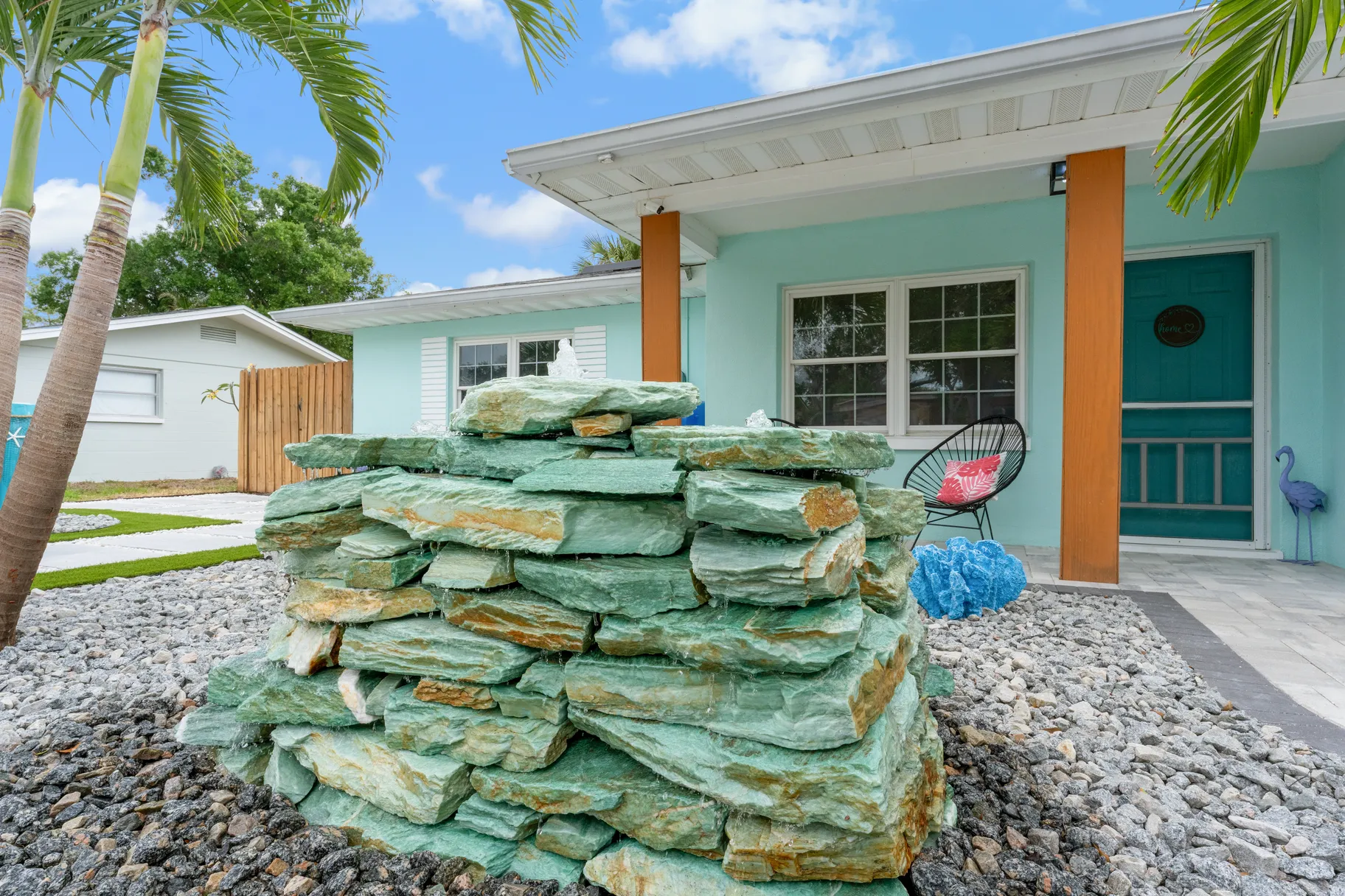 Paver driveway with decorative border at a Dunedin coastal home